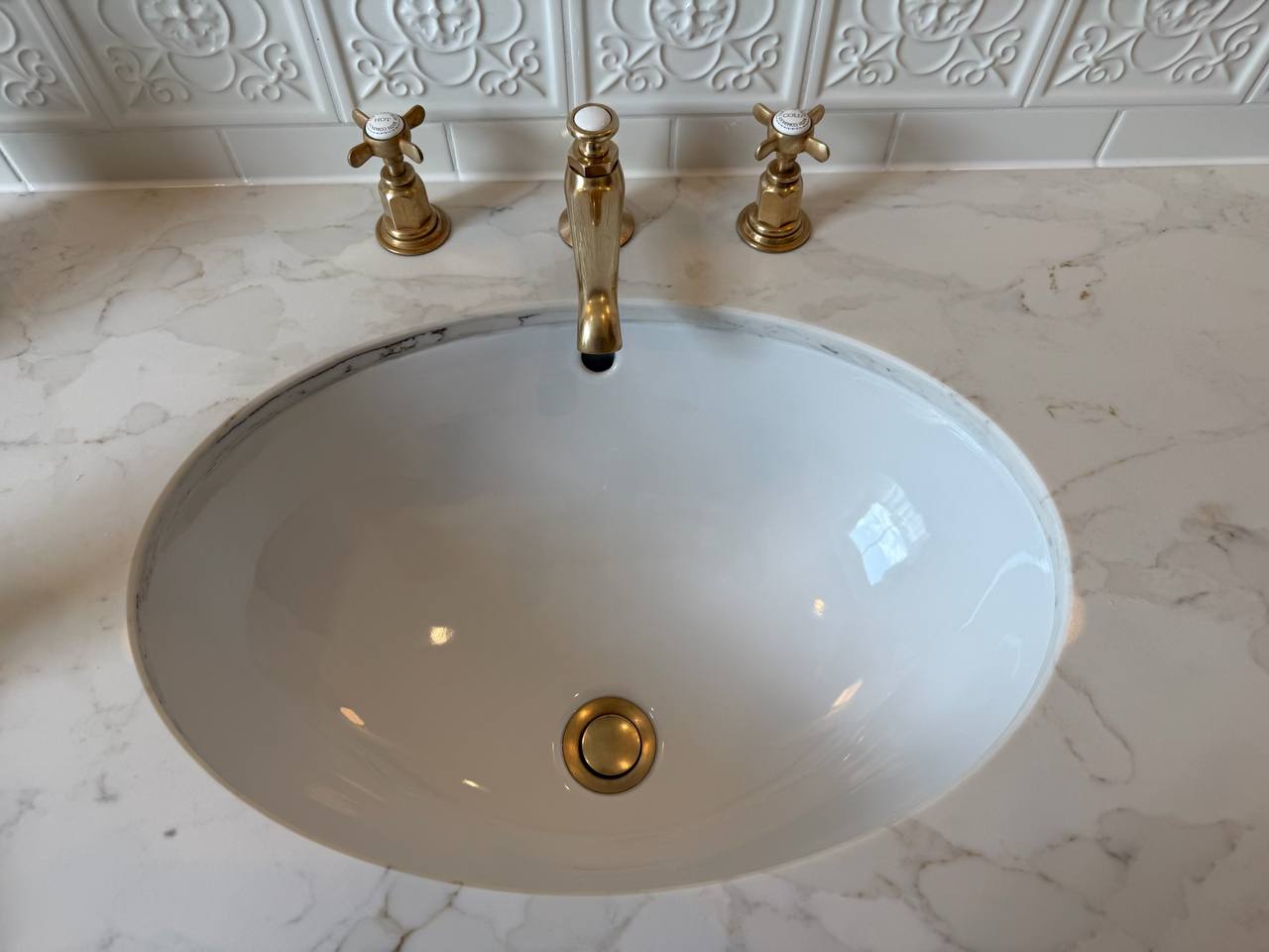 Gleaming bathroom sink and fixtures